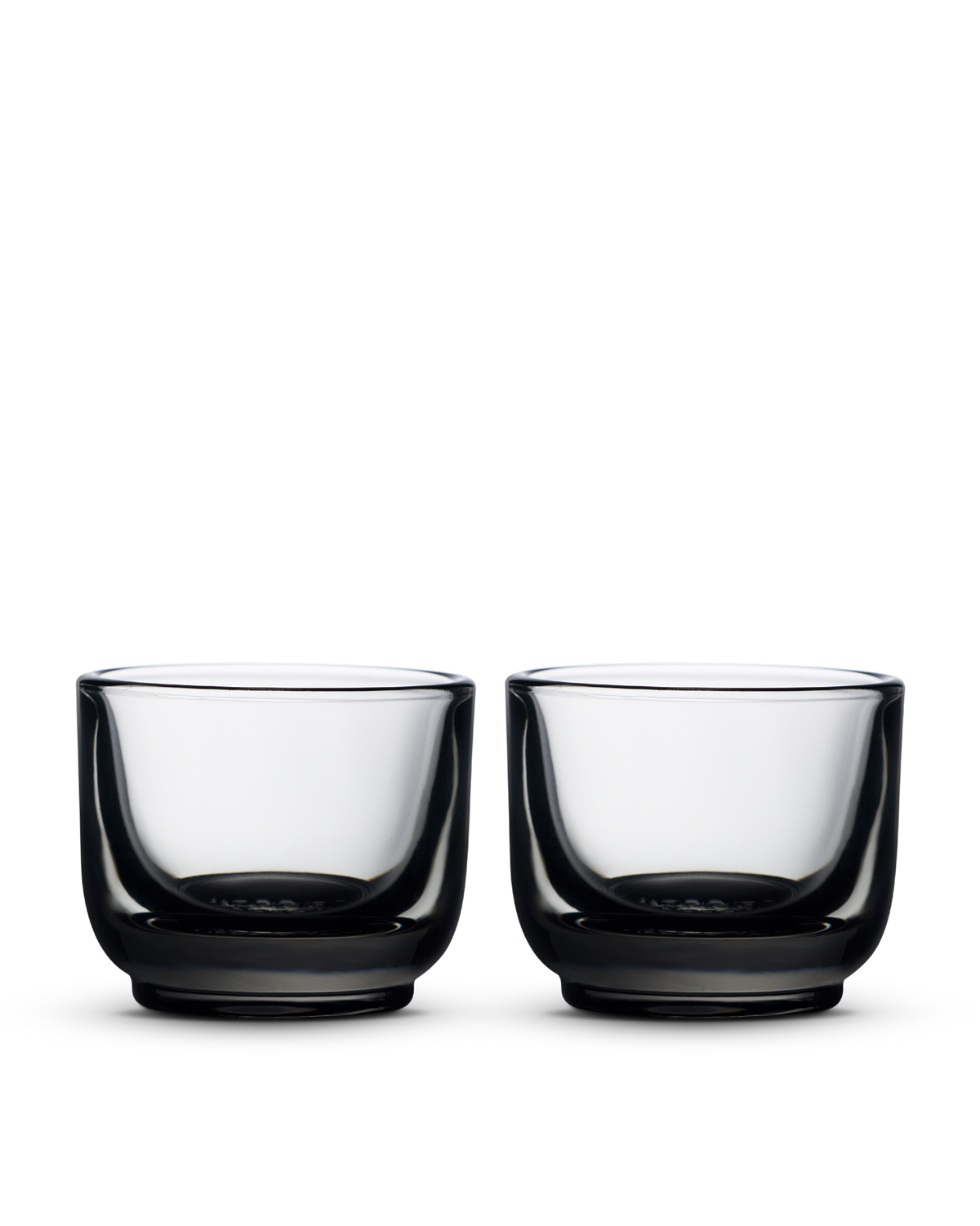 Two Fellow Pirch Espresso Glasses, thick-based, side by side on a white background.