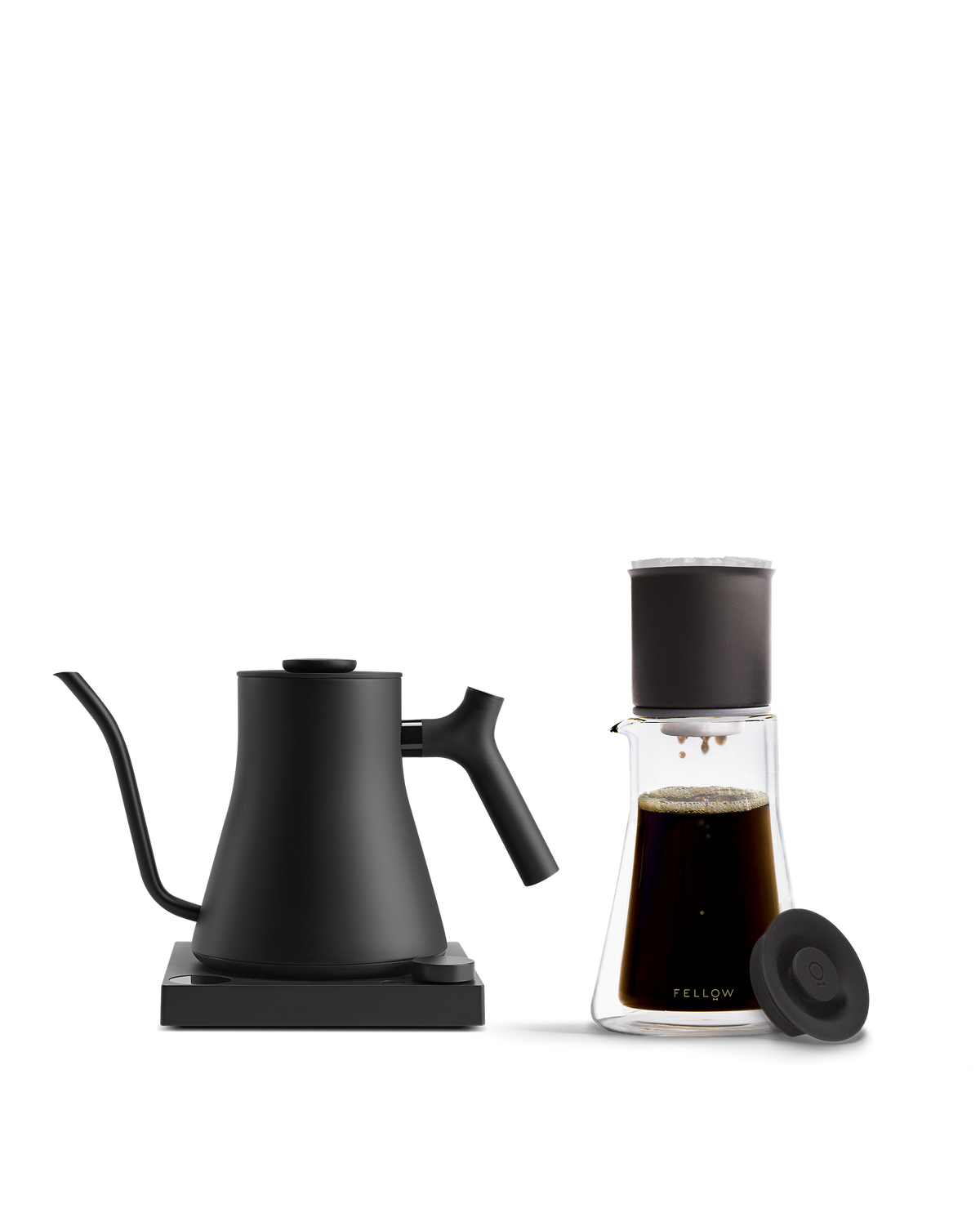 Fellow The Signature Brew Kit: black electric kettle & glass coffee set on white background.
